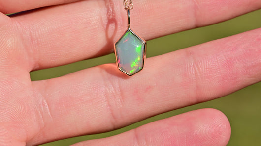 sheild cut opal in solid 14k yellow gold charm cut by opal cutter curtis r jewellery 