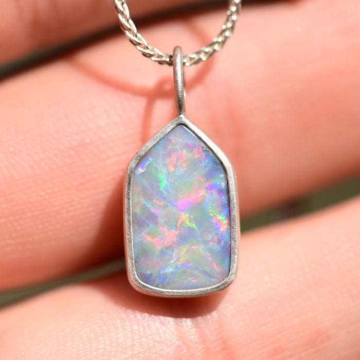 rainbow australian opal charm in matte silver by jewelry artist and lapidary cutter curtis r jewellery 