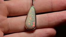 Load and play video in Gallery viewer, big white pear opal long crop pendant in sterling silver
