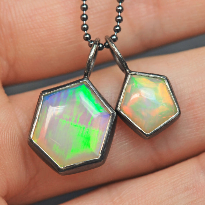 pair of geometric opal charms in sterling silver pentagon hexagon set opal jewelry by curtis r jewellery