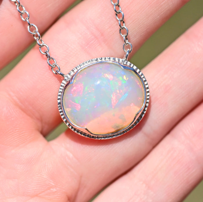 large white opal cabochon with rainbow play of colour, gem quality opal necklace by curtis r jewellery l